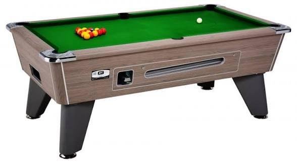 Coin-operated pool table with green cloth